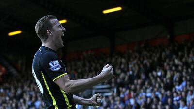 Tottenham Hotspur's Harry Kane celebrates scoring his second goal in Spurs's 2-1 win over Queens Park Rangers in the Premier League on Saturday. Adrian Dennis / AFP / March 7, 2015