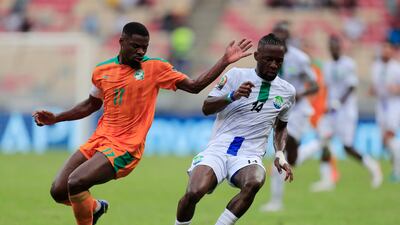 Mohamed Buya Turay, of Sierra Leone, turns away from Ivory Coast's Serge Aurier. Reuters