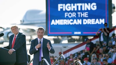 US President Donald Trump listens as Nigel Farage (R) speaks during a Make America Great Again rally at Phoenix Goodyear Airport October 28, 2020, in Goodyear, Arizona. / AFP / Brendan Smialowski