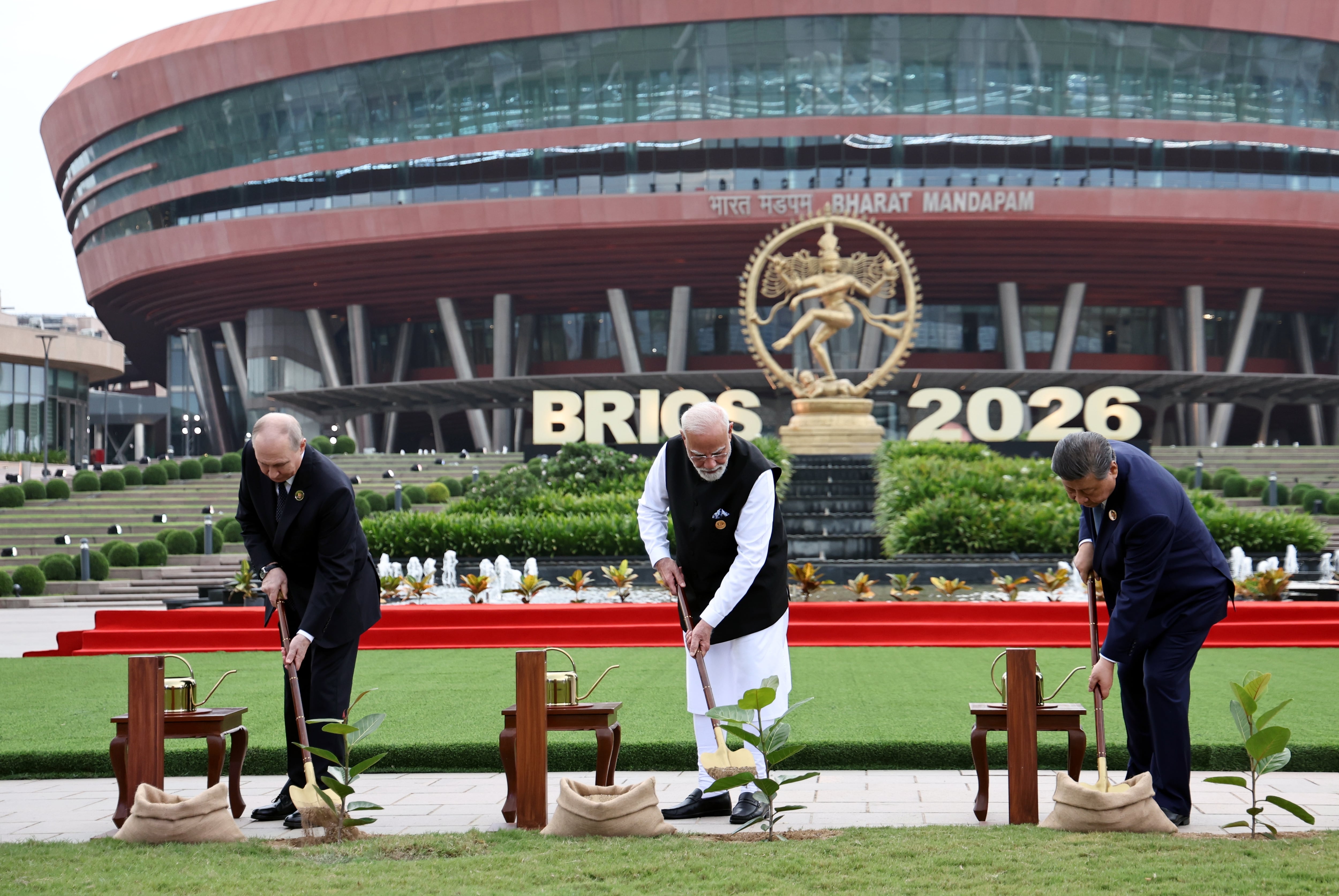 From left, Mr Putin, Mr Modi and Mr Xi at a joint banyan tree-planting ceremony. EPA