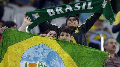 Brazil fans cheer during the quarter-final match of the men’s Olympic football tournament between Brazil and Colombia in Sao Paulo, Brazil, Saturday August 13, 2016. Brazil won the match 4-0.