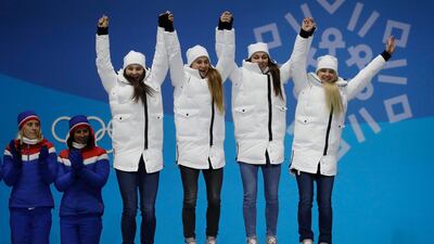 The team from Russia, bronze medalist in the women's 4 x 5km relay cross-country skiing, jump on the podium during the medals ceremony at the 2018 Winter Olympics in Pyeongchang, South Korea. Morry Gash / AP Photo