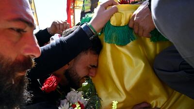 People attend a mass funeral of Hezbollah fighters who died during fights with the Israeli army before the ceasefire, in Kfar Kila village, southern Lebanon, this month. EPA