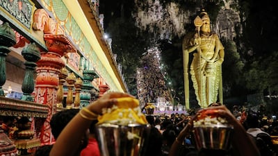 Hindu devotees climb the steps to Batu Caves during Thaipusam in Kuala Lumpur, Malaysia. Reuters