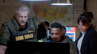 Mel Gibson, Eddie Steeples and Shannen Doherty in 'Hot Seat'. Photo: Lionsgate