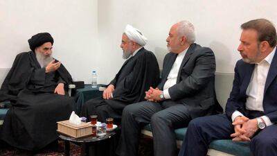 Iranian President Hassan Rouhani, second left, meets with Iraq's most senior Shiite cleric Grand Ayatollah Ali al-Sistani. AP