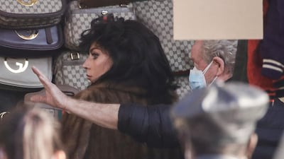 Director Ridley Scott, right, gives instructions to Lady Gaga during the shooting of 'House of Gucci' in Milan, Italy. AP photo