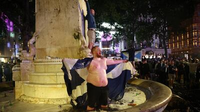 Scotland fans celebrate in London after the 0-0 draw with England. Reuters