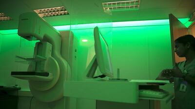 A radiology technician works inside a mobile mammogram clinic in Abu Dhabi (Silvia Razgova / The National)