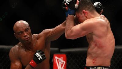 Anderson Silva delivers a punch to Nick Diaz during his unanimous decision victory in the main bout middleweight fight at UFC 183 on Saturday night. Steve Marcus / Getty Images / AFP