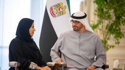 President Sheikh Mohamed with photographer Noura Al Neyadi. Photo: Rashed Al Mansoori / UAE Presidential Court