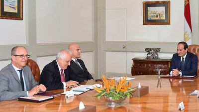 Eni chief executive Claudio Descalzi, third from left, and other company officials meet with Egyptian president Abdel Fattah El Sisi, right, regarding the latest gasfield discovery. MEAN via AP