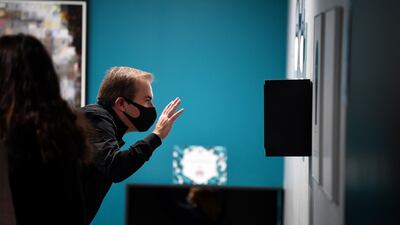 A man a wearing protective mask visits the Museum of Illusion in Paris, as France eased the lockdown measures taken to curb the spread of Covid-19. AFP