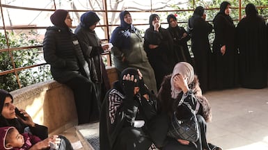 Displaced Palestinians mourn at the funeral of those killed in an overnight Israeli strike, in Khan Younis, Gaza, on February 15. AFP