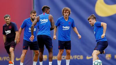Barcelona's Antoine Griezmann, second right, takes part in a training exercise. Reuters