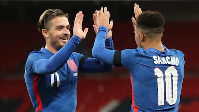 England's Jadon Sancho celebrates with Jack Grealish after scoring this side's second goal against the Republic of Ireland at Wembley. AP