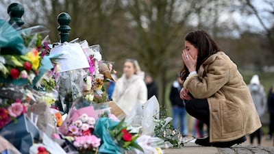 A woman pays tribute to Sarah Everard at Clapham Common bandstand, London. Getty Images