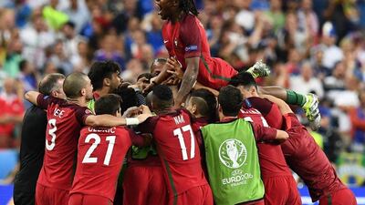 Portugal's players celebrate after they beat France during the Euro 2016 final at the Stade de France in Saint-Denis, north of Paris. Philippe Desmazes / AFP