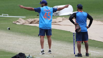 Rohit Sharma inspects the pitch during a practice session. AFP