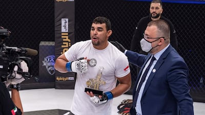 Brazilian Juscelino Ferreira is congratulated by Palms Sports general manager Fouad Darwish after his victory over Tarek Suleiman in the 90kg catchweight. Courtesy UAE Warriors