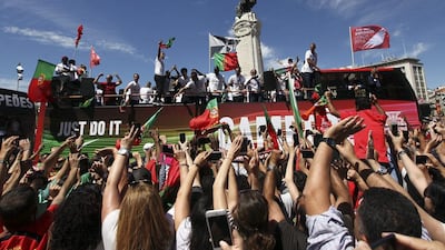 Portugal national soccer team supporters waving Portuguese flags and scarfs at Marquis of Pombal square as the Portuguese Team crosses Lisbon downtown, Portugal, 11 July 2016. The Portugal national soccer team on 10 July 2016 had won the UEFA Euro 2016 final against France by 1-0 to win the title for first time. EPA/NUNO VEIGA