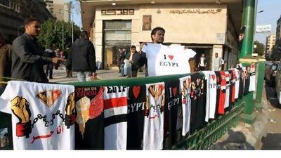 A street vendor displays T-shirts in downtown Cairo. Countries that have been affected by political unrest, such as Bahrain and Egypt, are looking to coax business travellers back.