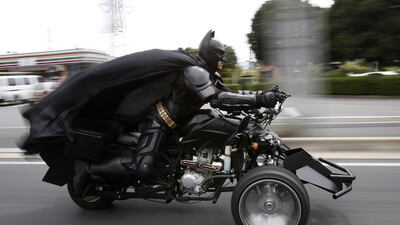 A 41-year-old man going by the name of Chibatman rides his “Chibatpod” on the road in Chiba, east of Tokyo. The man, who dresses up as the comic book superhero Batman, came up with his moniker after adding a prefix of the first three letters of the city name, of which he roams on his three-wheeled motorcycle. Yuya Shino / Reuters