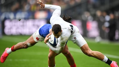 England's Jonny May (front) is tackled by France's Teddy Thomas during the Six Nations rugby union tournament in Saint Denis, France. AFP