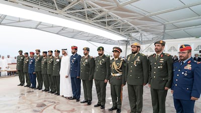 Sheikh Mohamed bin Zayed stands with members of the UAE Armed Forces. Rashed Al Mansoori/Ministry of Presidential Affairs