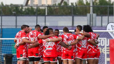 Dubai Tigers huddle before their match against Bahrain.