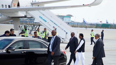South African President Cyril Ramaphosa walks alongside India's Minister of State for Railways, Coal and Mines Raosaheb Danve, on his arrival for the G20 summit. EPA