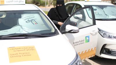 Learner Amira Abdelgader gets into a car for her driving lesson. Ahmed Jadallah / Reuters