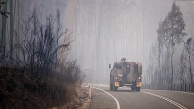 An ADF armoured vehicle personnel carrier is seen on the prince Highway near Mallacoota. Getty Images