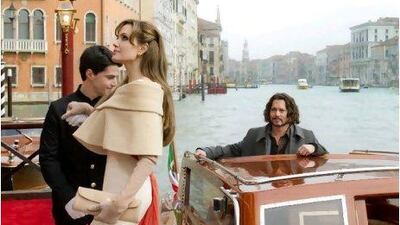 Angelina Jolie plays Elise, an Englishwoman looking for a man to trick into being her partner (Johnny Depp, right) in The Tourist.