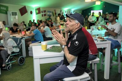 Football fans watch the opening match in the Fairmont Hotel's World Cup Tent in Dubai. Antonie Robertson / The National