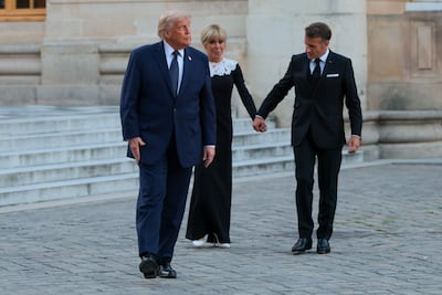 President of France Emmanuel Macron and his wife, Brigitte Macron, with US President Donald Trump at Chateau de Versailles. Getty Images