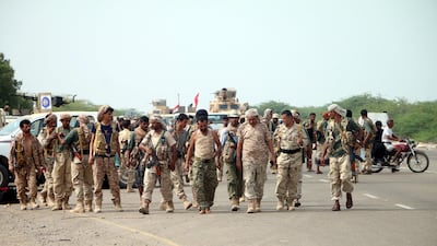 Yemeni forces backed by the Saudi-led coalition gather near the outskirts of the western port city of Hodeidah. EPA/NAJEEB ALMAHBOOBI