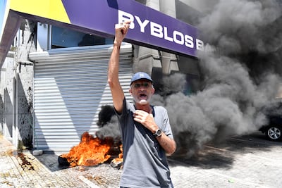 Protesters lit fires and smashed glass doors last week during a Beirut demonstration over Lebanon's banking crisis. EPA