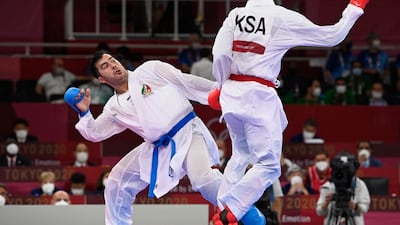 Saudi Arabia's Tareg Hamedi (R) competes against Iran's Sajad Ganjzadeh in the men's kumite +75kg final of the karate competition. Ganjzadeh was awarded the gold medal after Hamedi was disqualified in the final.