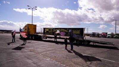 Protesters and lorry drivers start gathering before the departure of the People's Convoy, at the Adelanto Stadium, Adelanto, California, on February 22, 2022. EPA