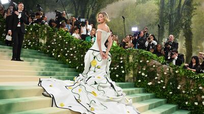 Gigi Hadid wears Thom Browne. AFP