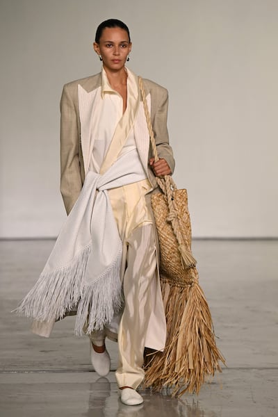 A model wears a fringed look during the Bottega Veneta spring/summer 2027 show at Milan Fashion Week. AFP