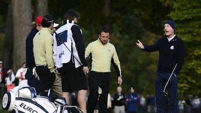 Jim Furyk, right, argues his point about Europe not getting a free drop at the second hole during the opening foursome of the 2012 Ryder Cup.