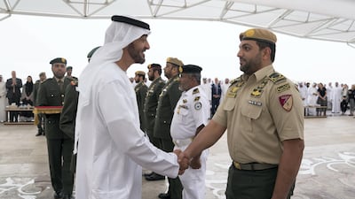 Sheikh Mohammed bin Zaye, awards a member of the UAE Armed Forces with a Medal of Bravery for his service in Yemen. Mohammed Al Hammadi / Crown Prince Court.