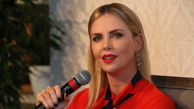 Actress Charlize Theron speaks at an event at the Global Education and Skills Forum in Dubai on Saturday - she talked about how she "lost her father to gun violence" and how the #MeToo movement is now unstoppable. AP / Jon Gambrell