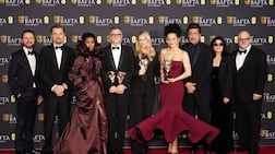 Andy Jurgensen, Leonardo DiCaprio, Teyana Taylor, Paul Thomas Anderson, Sara Murphy, Chase Infiniti, Benicio del Toro, Cassandra Kulukundis and Michael Bauman pose with the their awards for One Battle After Another. PA