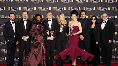 Andy Jurgensen, Leonardo DiCaprio, Teyana Taylor, Paul Thomas Anderson, Sara Murphy, Chase Infiniti, Benicio del Toro, Cassandra Kulukundis and Michael Bauman pose with the their awards for One Battle After Another. PA