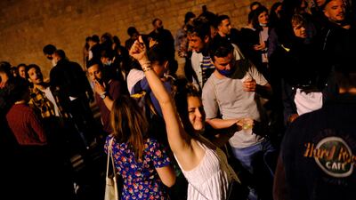 People in Barcelona celebrate the expiry of a six-month coronavirus curfew in Spain on Saturday. Reuters