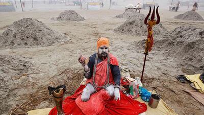 A Sadhu sits on the banks of river Ganges with his prosthetic leg on a cold winter morning in the northern Indian city of Allahabad. Jitendra Prakash / Reuters