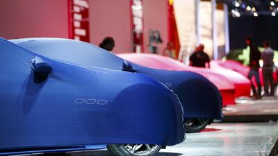 Maseratis, in blue covers, and Ferraris ready for unveiling when the Frankfurt International Motor Show opens. Kai Pfaffenbach / Reuters